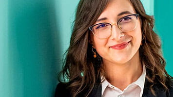 Confident woman in business attire, representing third party risk management contacts. Confident woman in business attire, representing third party risk management contacts.