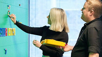 A woman sits in a modern office, symbolizing the core digital infrastructure behind enterprise technology solutions. A woman sits in a modern office, symbolizing the core digital infrastructure behind enterprise technology solutions.