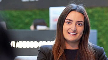 Two women discuss while working on laptops, representing virtual reality collaboration and immersive solutions. Two women discuss while working on laptops, representing virtual reality collaboration and immersive solutions.