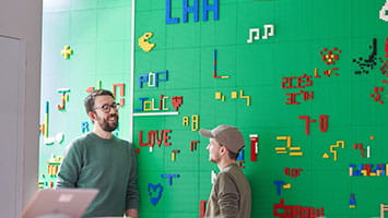 Two professionals collaborating in a diverse and inclusive workplace, representing the Adecco Group’s commitment to DE&I and workplace equity. Two professionals collaborating in a diverse and inclusive workplace, representing the Adecco Group’s commitment to DE&I and workplace equity.