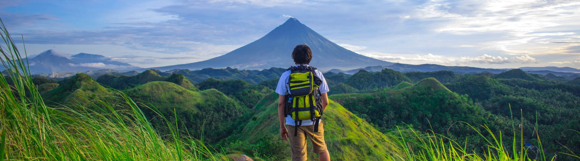 BANNER - Person hiking through mountains